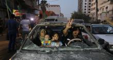 Palestinians gather in the streets of Gaza City 