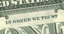 Photo: Dollar bill with "In Greed We Trust" printed on it.