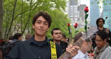 Photo of a guitar playing, part of the Occupy Guitarmy at May Day in NYC