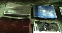 Photo of damaged laptops shown as evidence