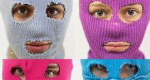 Photo of 4 members of Pussy Riot wearing colorful ski masks