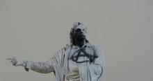 Statue of Rigas Feraios, Athens, Greece, sprayed with symbol of anarchy.