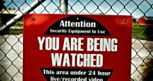 Poster that says, "Attention: You are being watched".