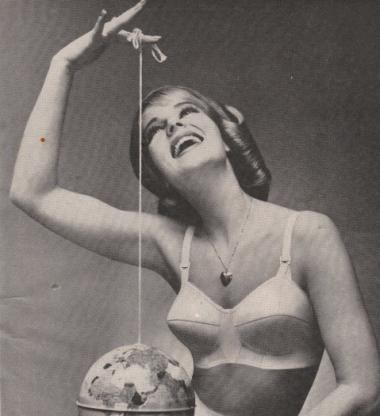 A woman dangles the globe on a string