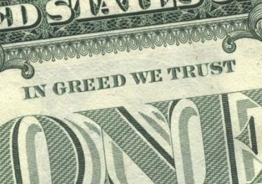 Photo: Dollar bill with "In Greed We Trust" printed on it.