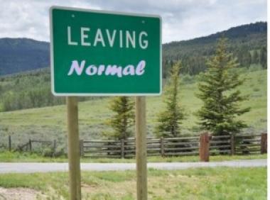 Photo of road sign reading, "Leaving Normal".