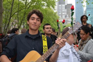 Photo of a guitar playing, part of the Occupy Guitarmy at May Day in NYC