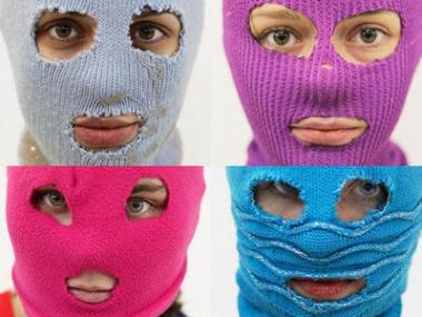 Photo of 4 members of Pussy Riot wearing colorful ski masks