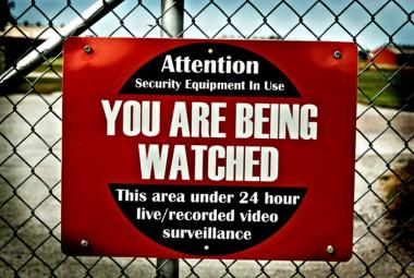 Poster that says, "Attention: You are being watched".